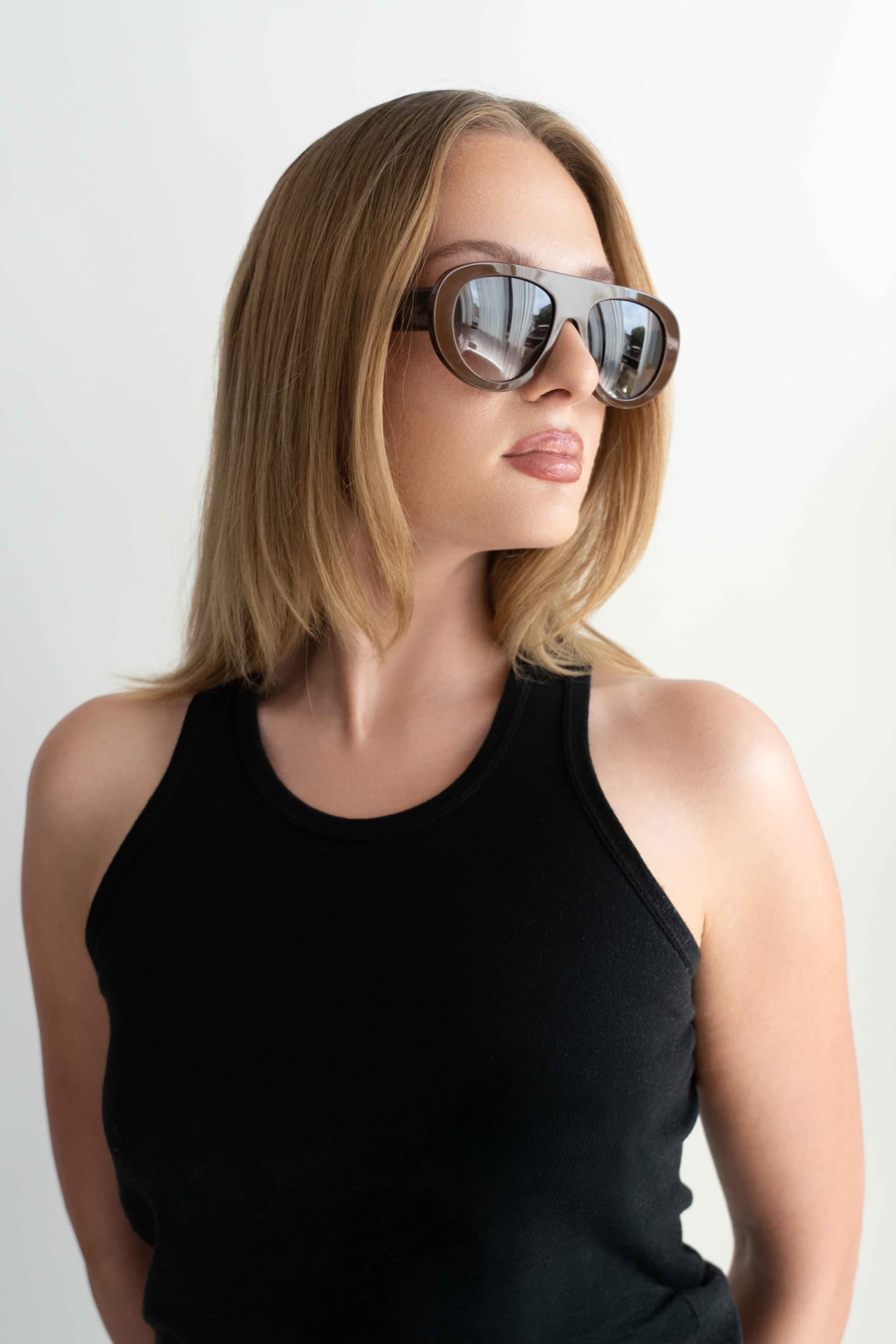 The Muse Brown sunglasses worn, lifestyle shot